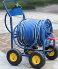 Top Shelf Garden Hose Reel Cart With Slick Rolling Wheels For Zero Hassle Storage And Quick Cleanup, blue sturdy frame on wheels.
