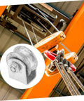 Installed heavy-duty cast-iron V-groove wheel for garage door or sliding gate on orange track