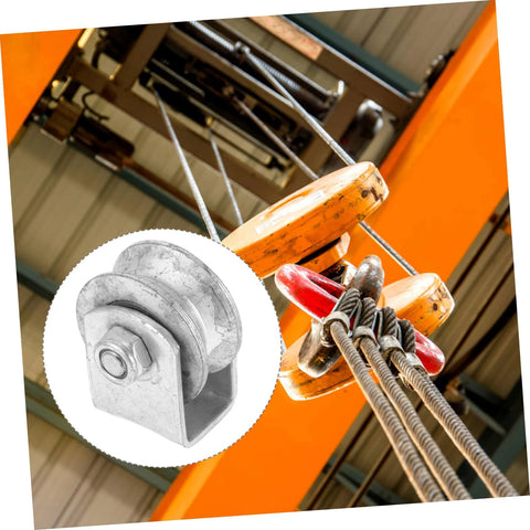 Installed heavy-duty cast-iron V-groove wheel for garage door or sliding gate on orange track