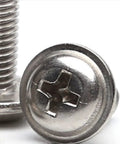 Top Shelf Heavy Duty 304 Stainless Steel Tapping Screws With Phillips Round Head And Cushion Washer Pad Rock Solid Corrosion Resistant Self Threading Fasteners For Tough Wood Or Metal DIY Jobs 100 Piece Set close-up view of screw head and thread.