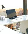 Slick Pop Up Countertop Outlet With Hidden Recessed Design, Wireless Charger Pad on an office desk setup with laptop and lamp.