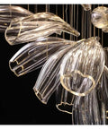 Luxury Creative Crystal LED Chandelier Glass Pendant Light Fixture For Dining Living Room Spaces with elegant sweeping glass design.