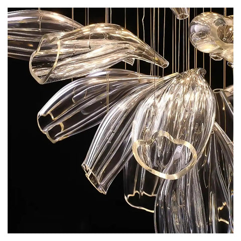 Luxury Creative Crystal LED Chandelier Glass Pendant Light Fixture For Dining Living Room Spaces with elegant sweeping glass design.