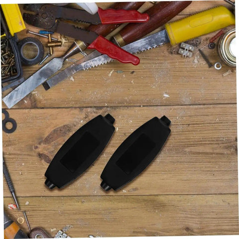 Two black enclosures from 20 Pack ABS Plastic Enclosure Boxes for Electronics Projects PCB Housing Black with Easy Install and Multi Wiring Configs Durable Storage Case for DIY Mods and a Pro Look on wooden workbench with tools.