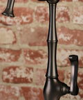 Close-up of Royale Cold Water Filtration Faucet In Oil Rubbed Bronze With Solid Brass Construction against brick wall