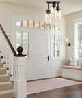 Three Light Matte Black Dope Semi Flush Mount Ceiling Light With Clear Glass Shades installed in stylish foyer.