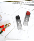 Hella Durable Heavy Duty Sliding Door Rollers And Silent Barn Door Caster Wheels With Vertical Support, metal brackets with wheels on a tiled surface.