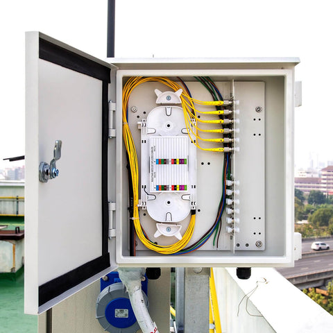 Open network panel with FC APC Square Single Mode Fiber Optic Coupler and Simplex Cable Adapter Pack Of 4 installed for signal distribution.