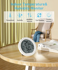 Easy Read Indoor Hygrometer Thermometer For Home And Office, Digital Temperature And Humidity Monitor With Large Display, Fast Accurate Room Climate Tracker For Optimal Comfort. Round white desktop digital hygrometer on wooden table