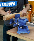 Man using Heavy Duty 4 Inch Bench Vise With 360 Degree Swivel Base And Anvil for clamping wood in a workshop