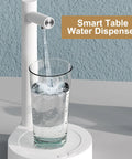 Intelligent Desktop Barrel Water Dispenser Pump, Removable Automatic Pour filling a glass with water on a table.