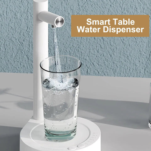 Intelligent Desktop Barrel Water Dispenser Pump, Removable Automatic Pour filling a glass with water on a table.
