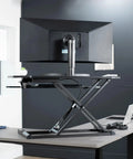 Extra Wide 38 Inch Corner Desk Converter With Height Adjustable Sit To Stand Riser For Dual Monitor And Laptop Setup Large 38 Inch Surface And Wide Keyboard Tray Black, shown in office setting with single monitor