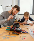 Father and son building with Total 59 Piece Hand Drill Bits Set for Resin Wood and Jewelry Making visible on table.
