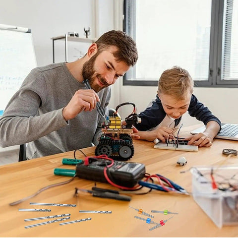 Father and son building with Total 59 Piece Hand Drill Bits Set for Resin Wood and Jewelry Making visible on table.