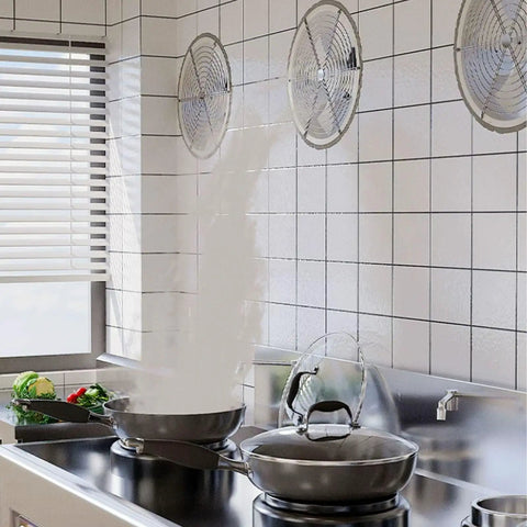 Heavy Hitter Industrial Turbine Fan That Goes Hard With Top Notch Ventilation And A Smooth Exhaust Setup Featuring Six Blades For Wide Angle Cooling Across Workshops And Garages On Standard Residential Voltage in a kitchen with square tiles and steam rising from pans.