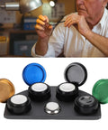 Stainless Steel Watch Oil Dip Tool With Lid Four Eye Oil Dish for precision lubrication shown on a workbench.