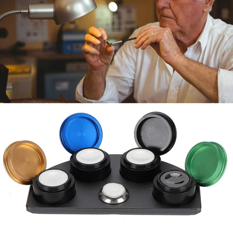 Stainless Steel Watch Oil Dip Tool With Lid Four Eye Oil Dish for precision lubrication shown on a workbench.