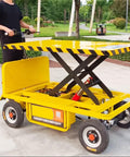 Heavy Duty Hydraulic Lift Table And Four Wheel Manual Push Platform designed for pallet handling at busy job sites.