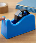 Portable Plastic Tape Dispenser With Weighted Non Slip Base And Vertical Roll Mechanism, Quick Release Blade, Desk Side Organizer For Washi And Masking Tapes, Great For Office, School, And Stationery Setups in blue plastic