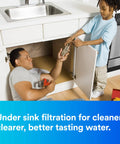 Father installing Undersink Reverse Osmosis Membrane Cartridge ROM413, child assisting, promoting clean drinking water.