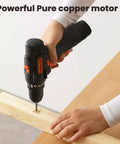 12V Cordless Drill Driver The Go Heavy Lifter With A Zippy 2.0Ah Battery, being used to drill into a wooden plank.