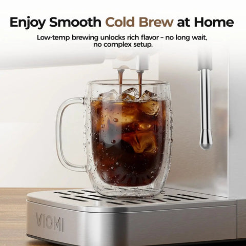 Sick Home Barista Essential Featuring Professional Espresso Machine With Milk Frother And Instant Cold Brew Maker For No Sweat Daily Grinds And Smooth 20 Bar Extraction Vibes. Fresh cold brew coffee pouring into a glass with ice.