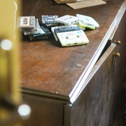 Wooden dresser featuring a partially open drawer fitted with Set Of Twelve Sleek Round Antique Brass Cabinet Knobs For Rustic Modern Kitchens And Vintage Furniture Makeovers One And One Eighth Inch Diameter Durable Hardware For Cabinets Drawers And Dressers With Bold Rustic Charm