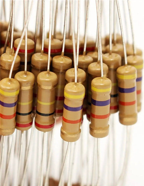 Close-up of carbon film resistors from 1W Carbon Film Resistor Kit Pack For Electronics DIYers, Assorted 1K To 2M Ohm, 5 Percent Tolerance.