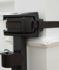 Close-up of wall mounting bracket for Wood Banister And Stair Safety Gate For Babies And Pets, adjustable and oak finish.