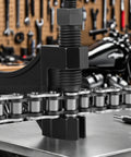 Chain Breaker Tool For 420 To 530 Roller Chains With Separate Pin Design on workbench in motorcycle workshop
