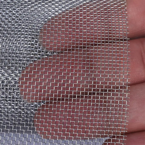Close-up of Stainless Steel Air Vent Mesh Screen Sheet 30x120cm Wire Mesh Roll 30 Mesh for vents, hand showing detail.