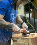 Person using No Bull 4 Inch 14 Tooth Carving Saw Disc For Angle Grinders on wood, carving and shaping materials.