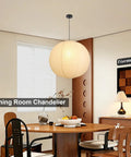 Large Off White Paper Pendant Light 23.6 Inch Japanese Rice Paper Ceiling Lamp With Cord And Canopy over dining table.