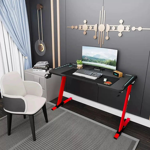Dope Rose Pink Gaming Desk With Rgb Ambient Glow Spacious Pc Worktable For Home Office And Bedroom Setup showing black and red design.