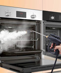Dude This 1700W Steam Cleaner Is A Total Beast And Perfect For Deep House Cleaning, cleaning an oven with high-pressure steam.