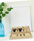 Slick Nine Grid Linen Watch Organizer Tray With Snug Padded Pillows displaying four watches on a light background.