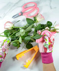 Rose Thorn Tools Set With Rose Leaf Thorn Strippers Pruning Shears Pink Garden Gloves And Florist Scissors For Easy Thorn Removal And Pruning In The Garden Kit For Easy Rose Care At Home, displayed with leaves and gloves on a white surface.