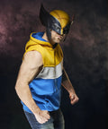 Legit Screen Accurate Wolverine Premium Roleplay Mask Featuring Authentic Movie Details And Officially Licensed Construction For Top Shelf Adult Collectibles And Zero Fuss Cosplay worn with a blue and yellow hoodie, showcasing a powerful stance.