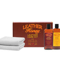 Hardcore Leather Care Kit With Nontoxic Conditioner And Gentle Cleaner For Deep Rejuvenation, two bottles and towels.