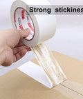 Heavy Duty White Duct Tape 2 Inch By 30 Yards 3 Pack 8.27 Mil All Weather Tear By Hand No Residue in use on cardboard box