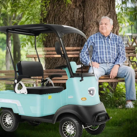 Heavy Duty 60V 800W AC Motor Mobility Scooter With 14.9 Inch Tires And Heckuva 28 Mile Range, really smooth operator parked by a bench.