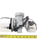 Genuine OEM Drain Pump Assembly AHA72973309 for washing machines, measuring tape beside for scale, wiring harness visible