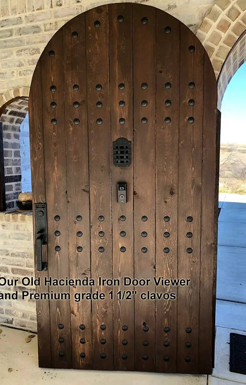 Wooden door with Premium One And A Half Inch Clavos Nails With Matte Black Powder Coat Finish built to last, outdoor use.