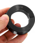 Split Shaft Collar Set, Two Piece Clamping Collar For 1-7/16 Inch Shaft, black oxide steel, held in hand, close-up view
