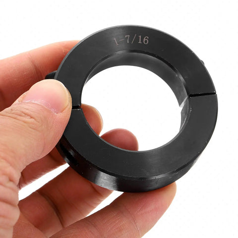 Split Shaft Collar Set, Two Piece Clamping Collar For 1-7/16 Inch Shaft, black oxide steel, held in hand, close-up view