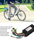 Three Mode Sine Wave Brushless DC Motor Controller Kit for DIY Electric Bike Projects laying on grass near person cycling