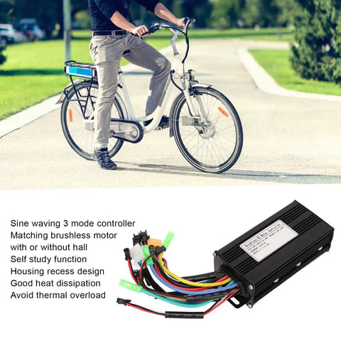 Three Mode Sine Wave Brushless DC Motor Controller Kit for DIY Electric Bike Projects laying on grass near person cycling