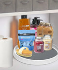 Set Of Two 12 Inch Non Skid Lazy Susan Organizer Smooth Spinning Turntable For Pantry Cabinet Kitchen Storage Game Changer With Super Grippy Rubber Base And Ball Bearings holding various personal care items in a cabinet.