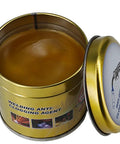 Tin of anti-spatter welding gel, open, with smooth surface, labeled 'Welding Anti-Clogging Agent' for MIG nozzles and clean welding.